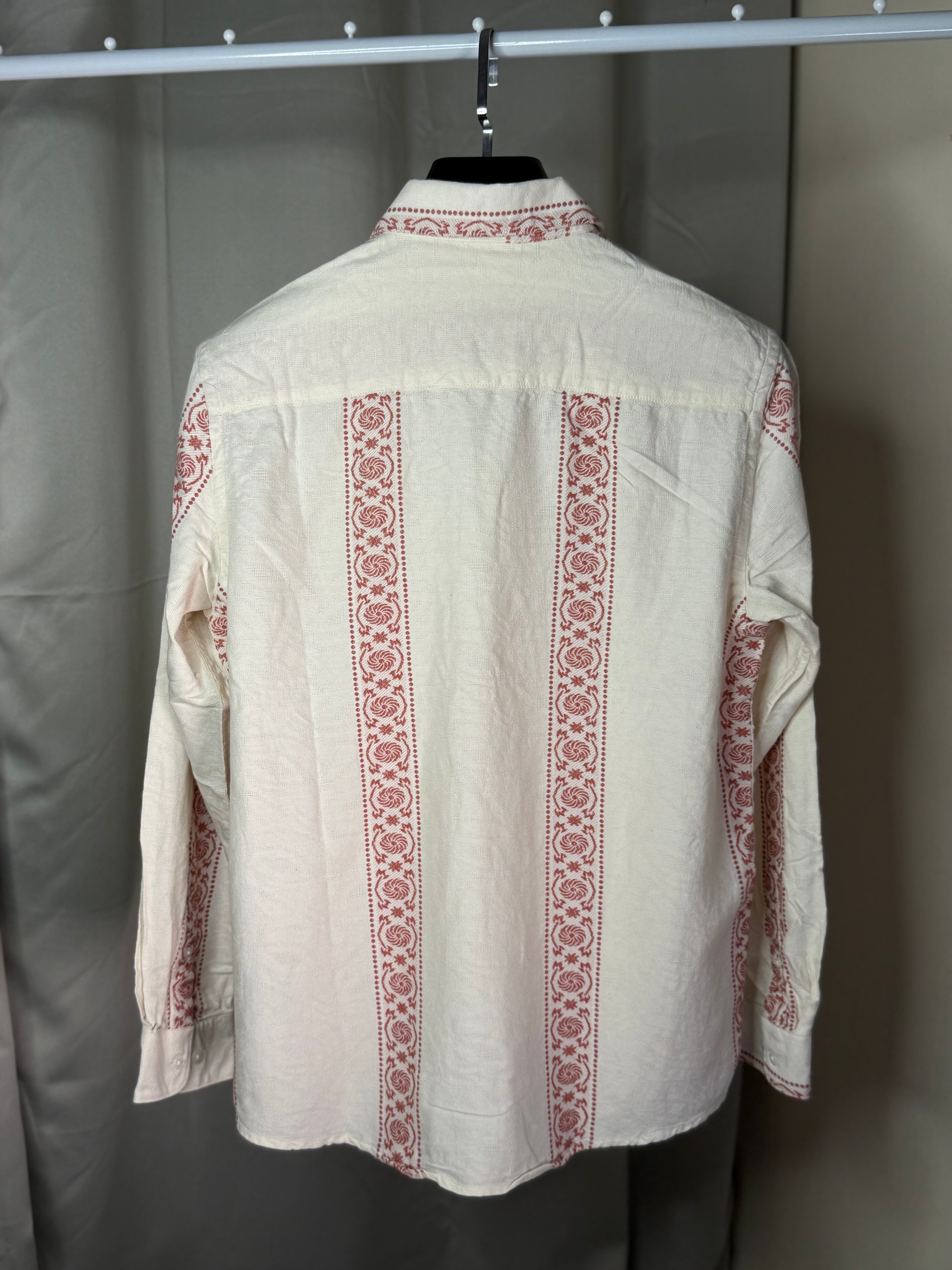white and red patterned long-sleeve shirt