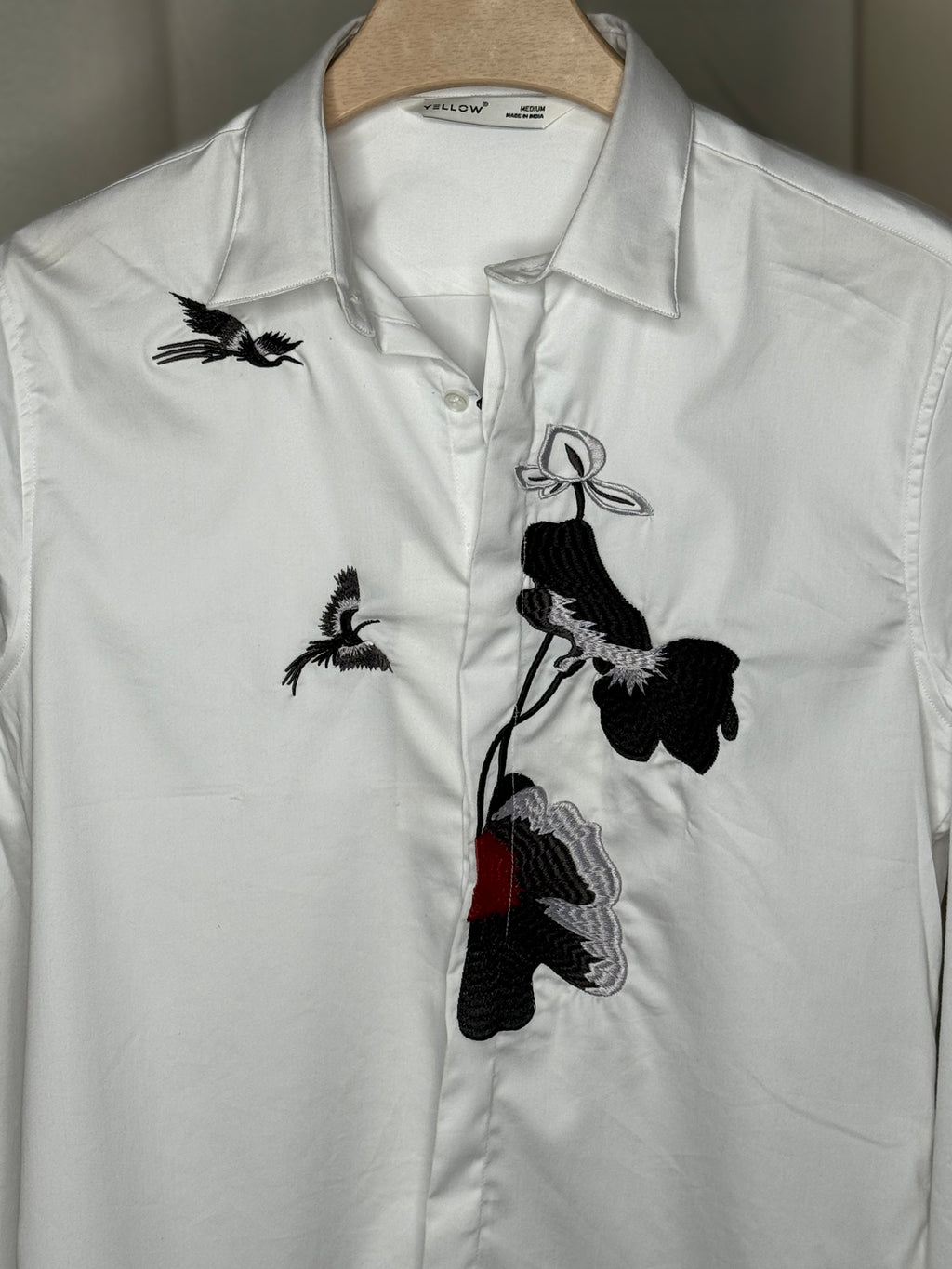 white embroidered printed shirt