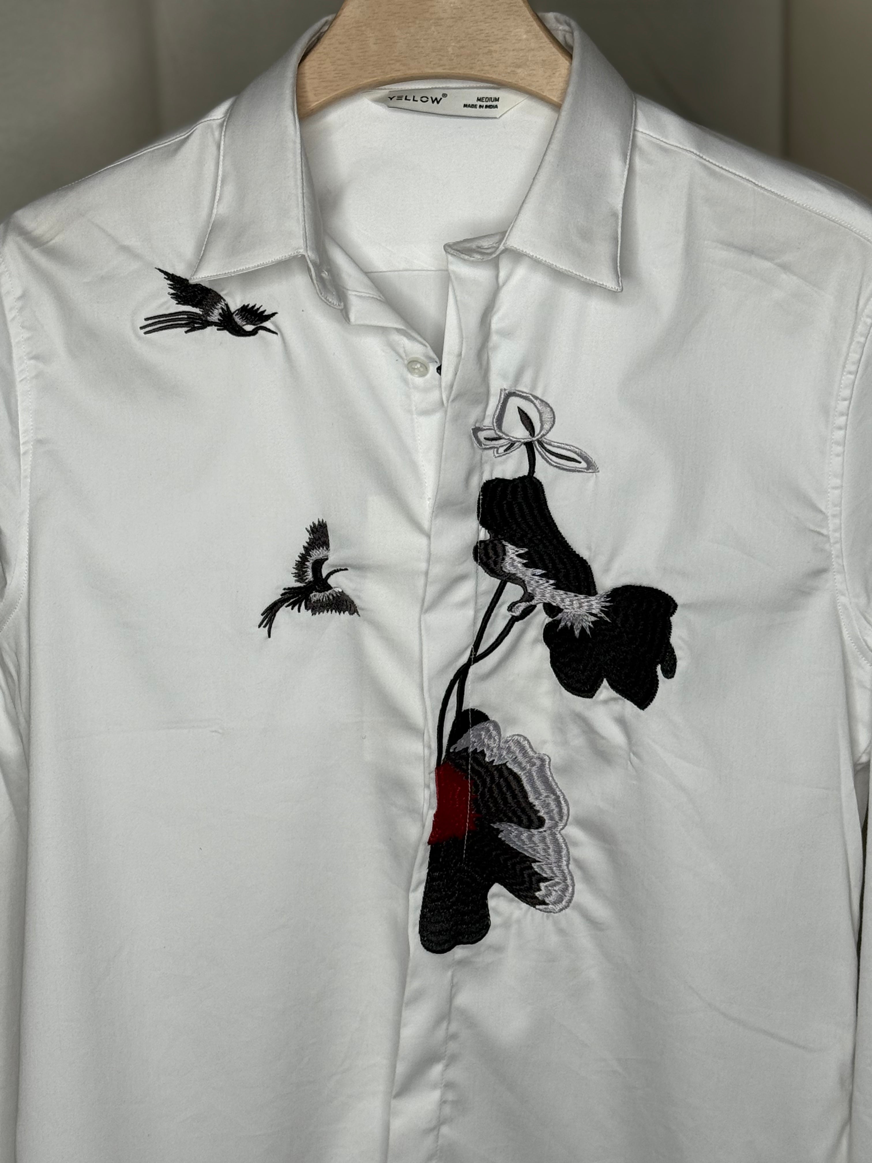 white embroidered printed shirt