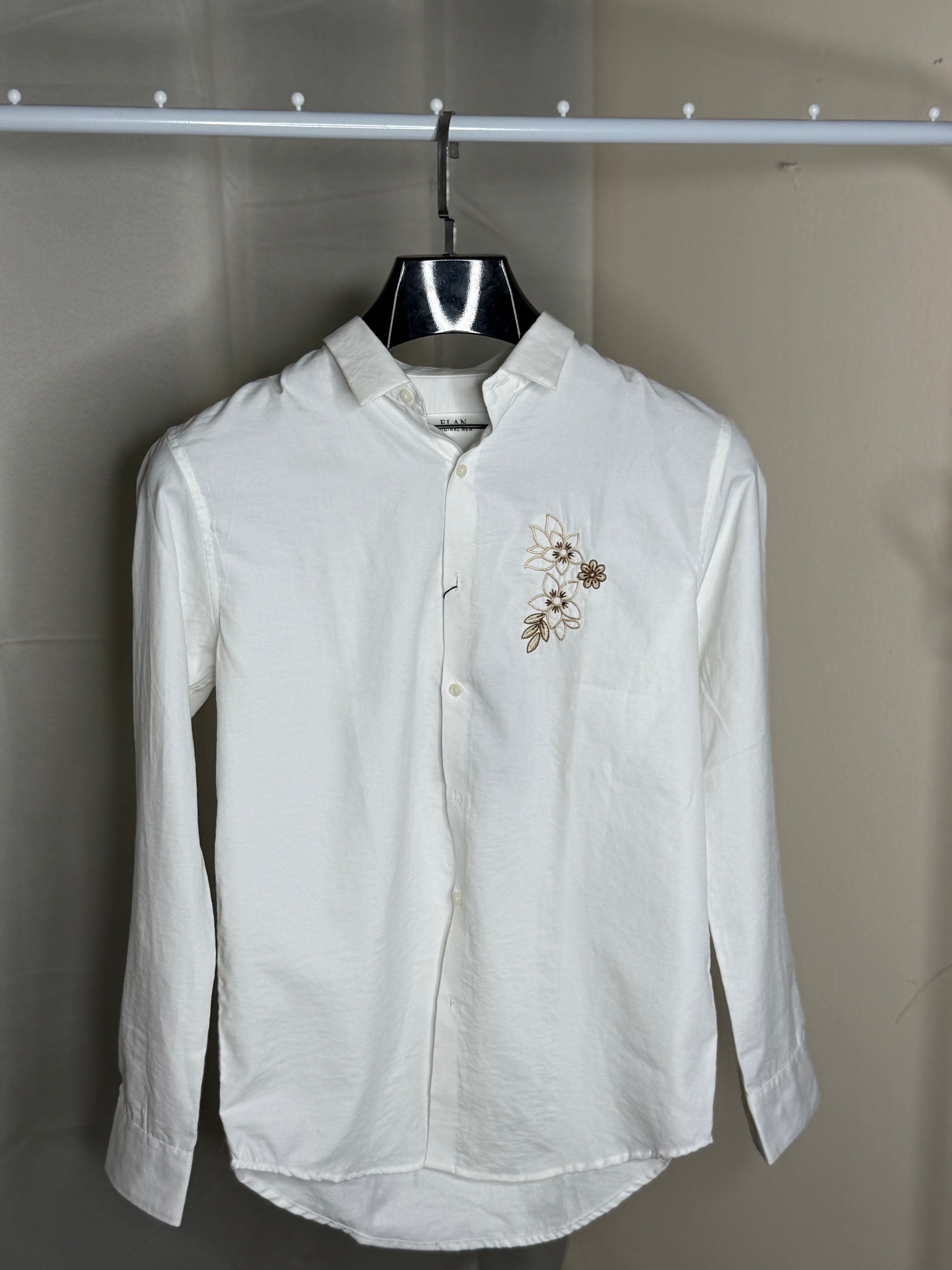white embroidered printed shirt