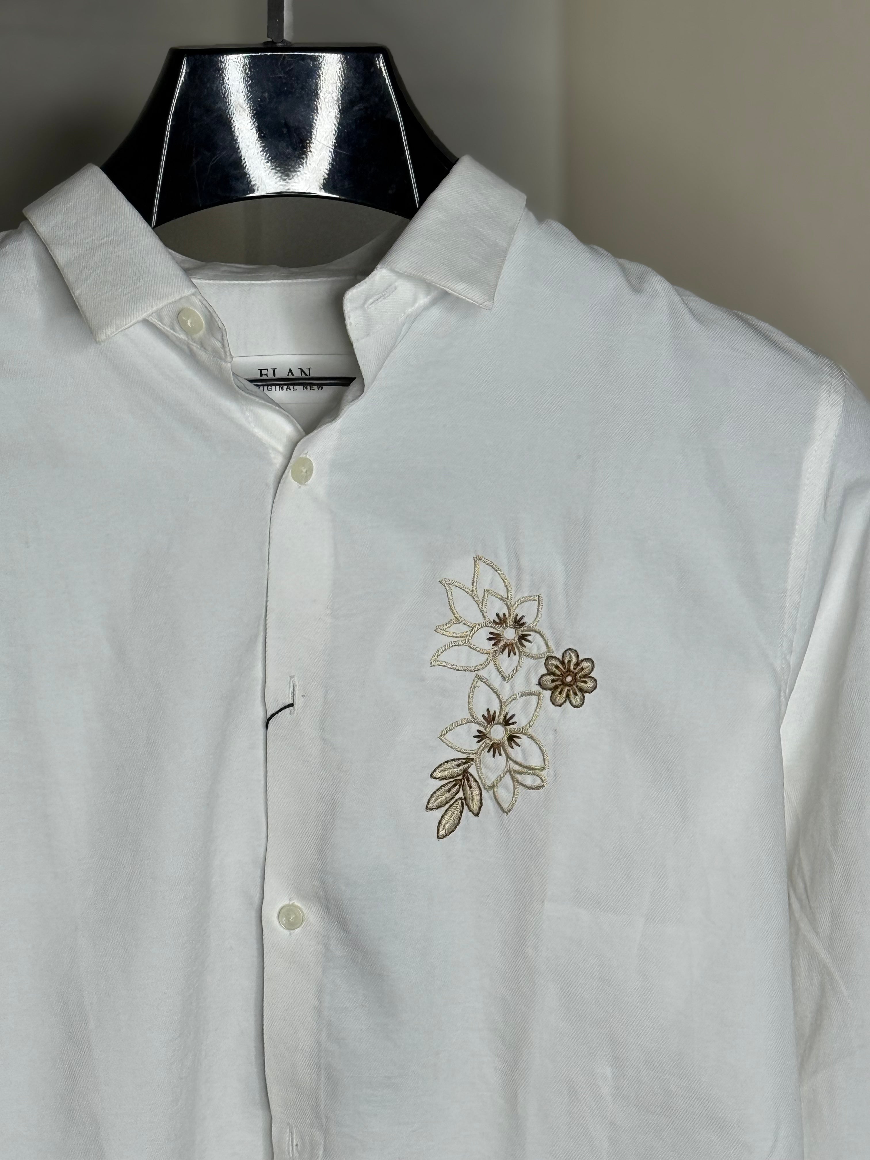 white embroidered printed shirt